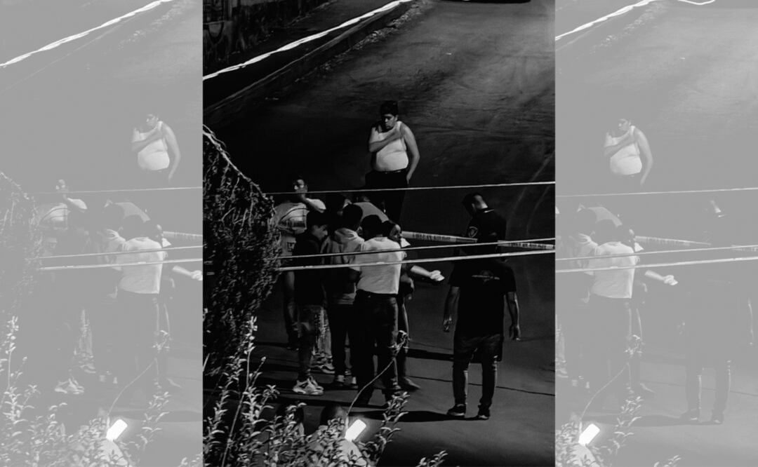 El cuerpo del taxista quedó tendido en la calle.