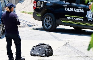 ¡Maleta rellena! Vecinos de Naucalpan pensaron que era basura, pero escondía un cadáver baleado