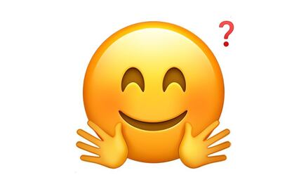 ¿Qué representa el emoji de la cara sonriente con las manos abiertas en WhatsApp?