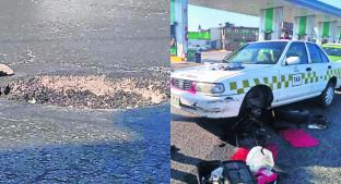 Coladera sin tapa causa daños a vehículos, en Paseo Tollocan . Noticias en tiempo real