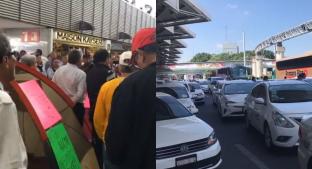 Taxistas de Aeropremier bloquean acceso a terminal 1 del Aeropuerto de la CDMX. Noticias en tiempo real