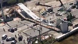 Puente peatonal colapsa y deja a personas atrapadas, en Florida