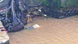 Hallan cuerpo de mujer baleada en río de Amacuzac