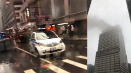 edificio rascacielos helicóptero se estrella impacta fuego incendio bomberos manhattan nueva york