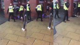 Guardia seguridad McDonald's golpea hombre calle video