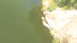 Hallan cadáver de un hombre envuelto en una cobija en la entrada de una presa, en Morelos