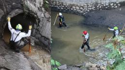 Buscan en aguas negras y túneles a joven de 18 años arrastrada por inundación, en Tlalnepantla