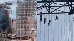 Obreros se llevan el sustazo de sus vidas tras quedar colgados a 140 metros del suelo