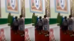 Sacerdote golpea a niños en misa | VIDEO