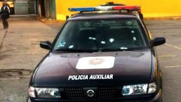 Policía recibe dos disparos y vive para contarlo